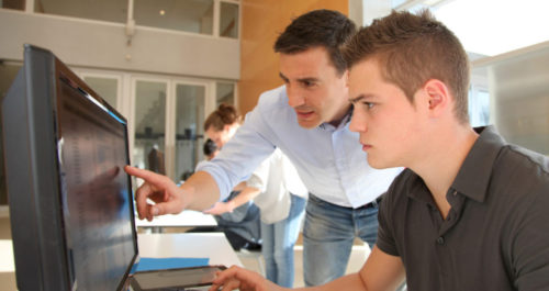 Computer Instructor Helping a Student Learn WordPress and SEO Classes and Training